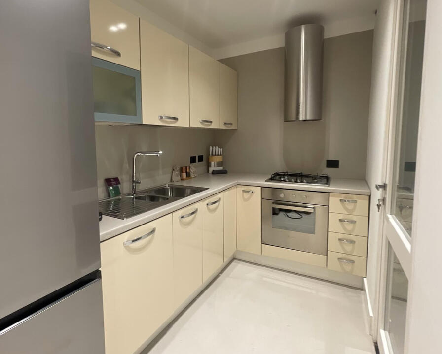 Cook and prepare great meals—fully equipped kitchen with premium appliances and elegant design. Modern CREO kitchen in Olbia townhouse with premium appliances, elegant finishes, and family-friendly layout