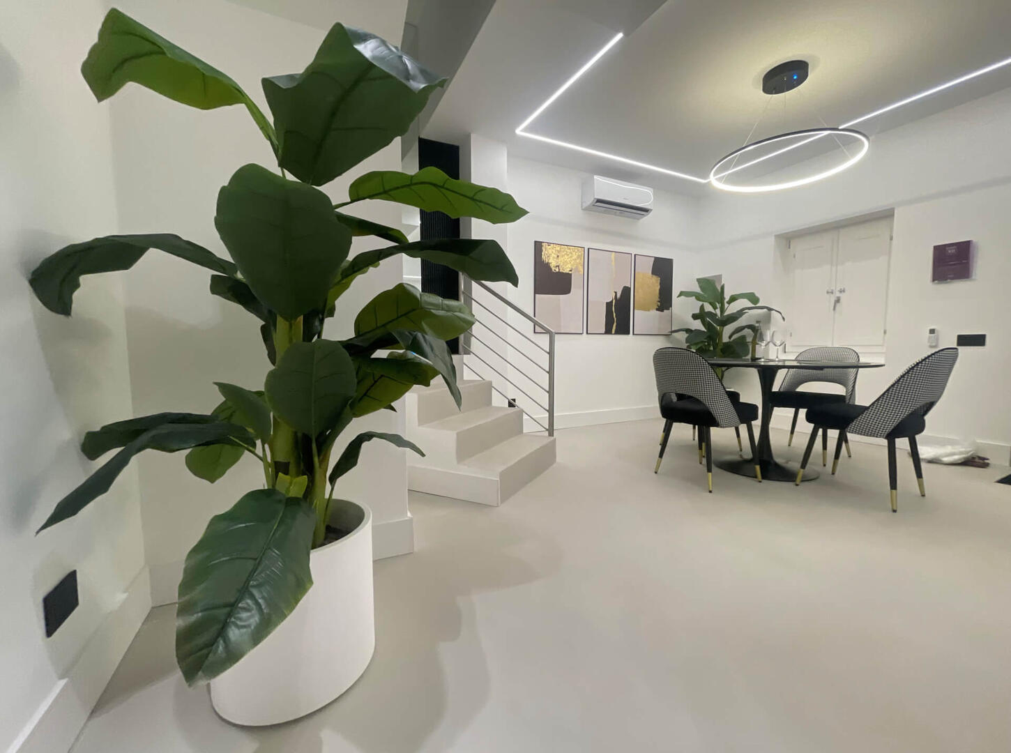 Stretch out in style—a spacious designer living room with a smart TV, comfy seating, and elegant finishes.